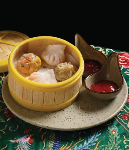 Mangan dim sum served on a Peranakan patterned table